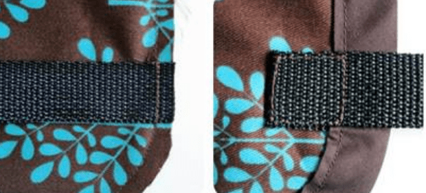 Webbing sewn to the side edge of a fabric organizer