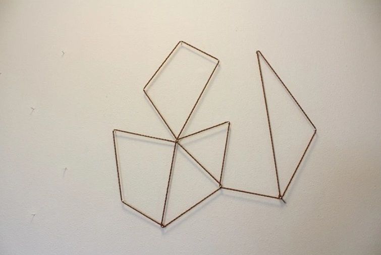 Nails driven into the wall for string art