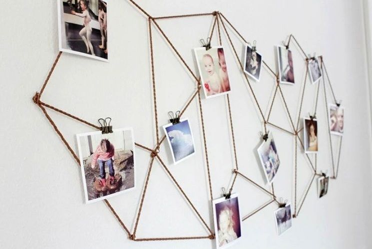 Photos hung with binder clips