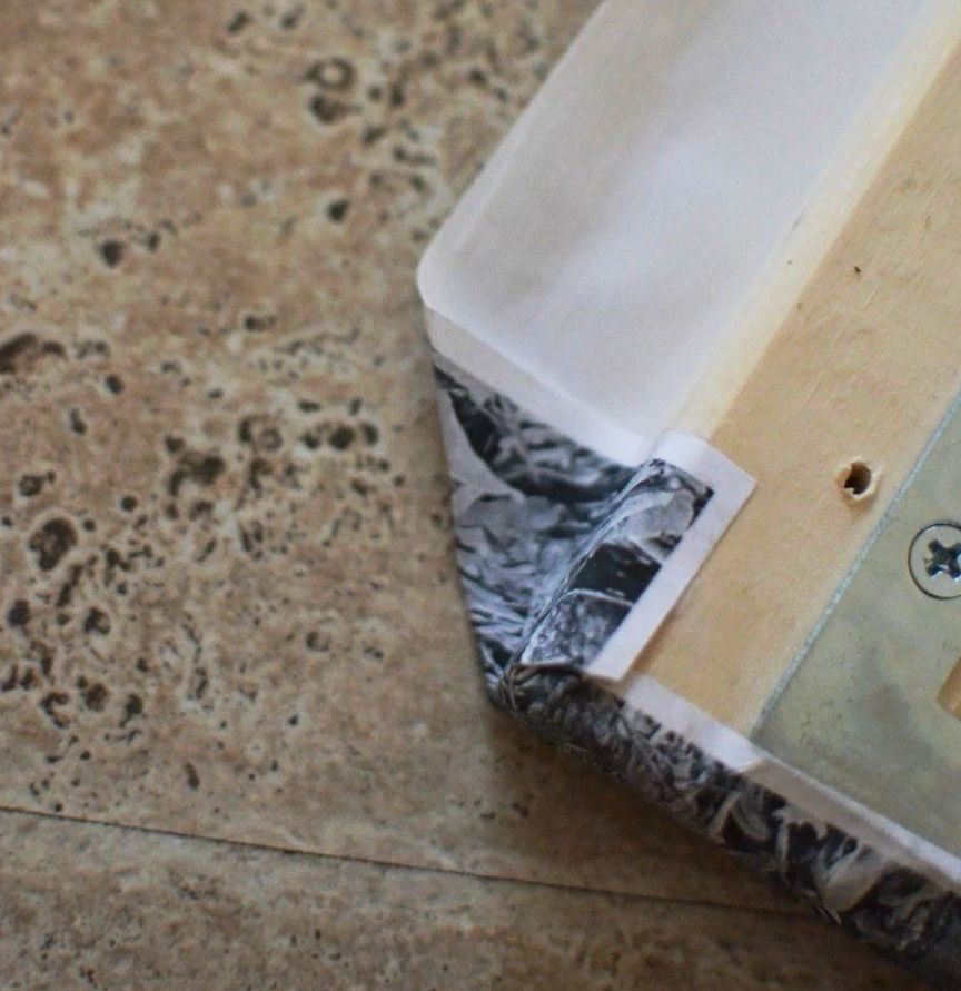 Securing photo corners on a stretcher bar