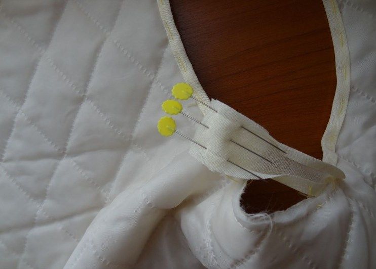 Pinned ends of the bias tape after joining into a loop