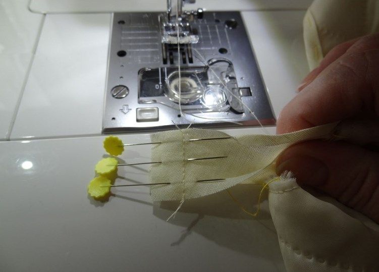 Ends of the bias tape pinned together before machine stitching