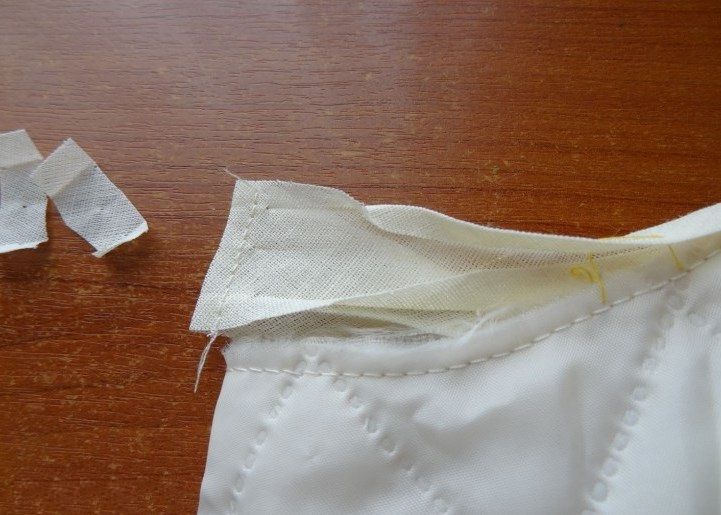 Trimming the seam allowances on the joined bias tape