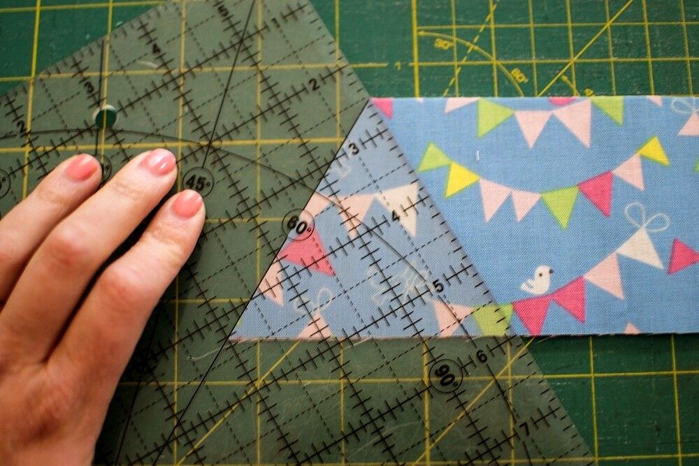 Close-up of a transparent acrylic patchwork ruler on fabric