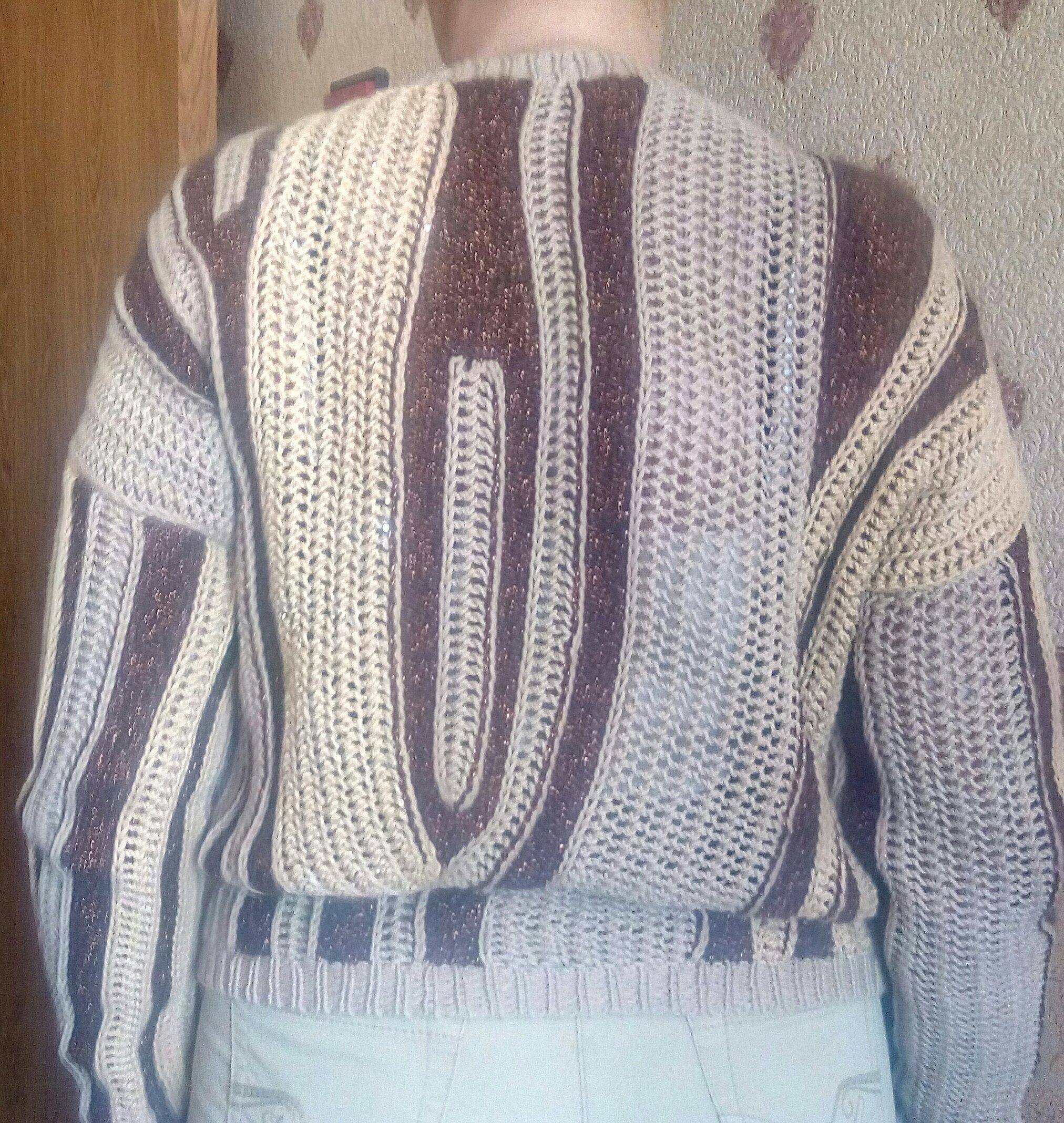 Back view of a cream and brown striped knit sweater