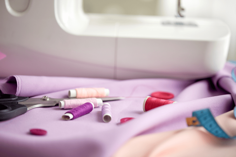 Sewing machine with fabric and tools