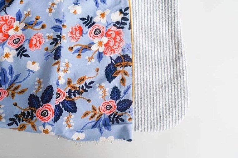 Piping between a floral lining and a striped garment piece