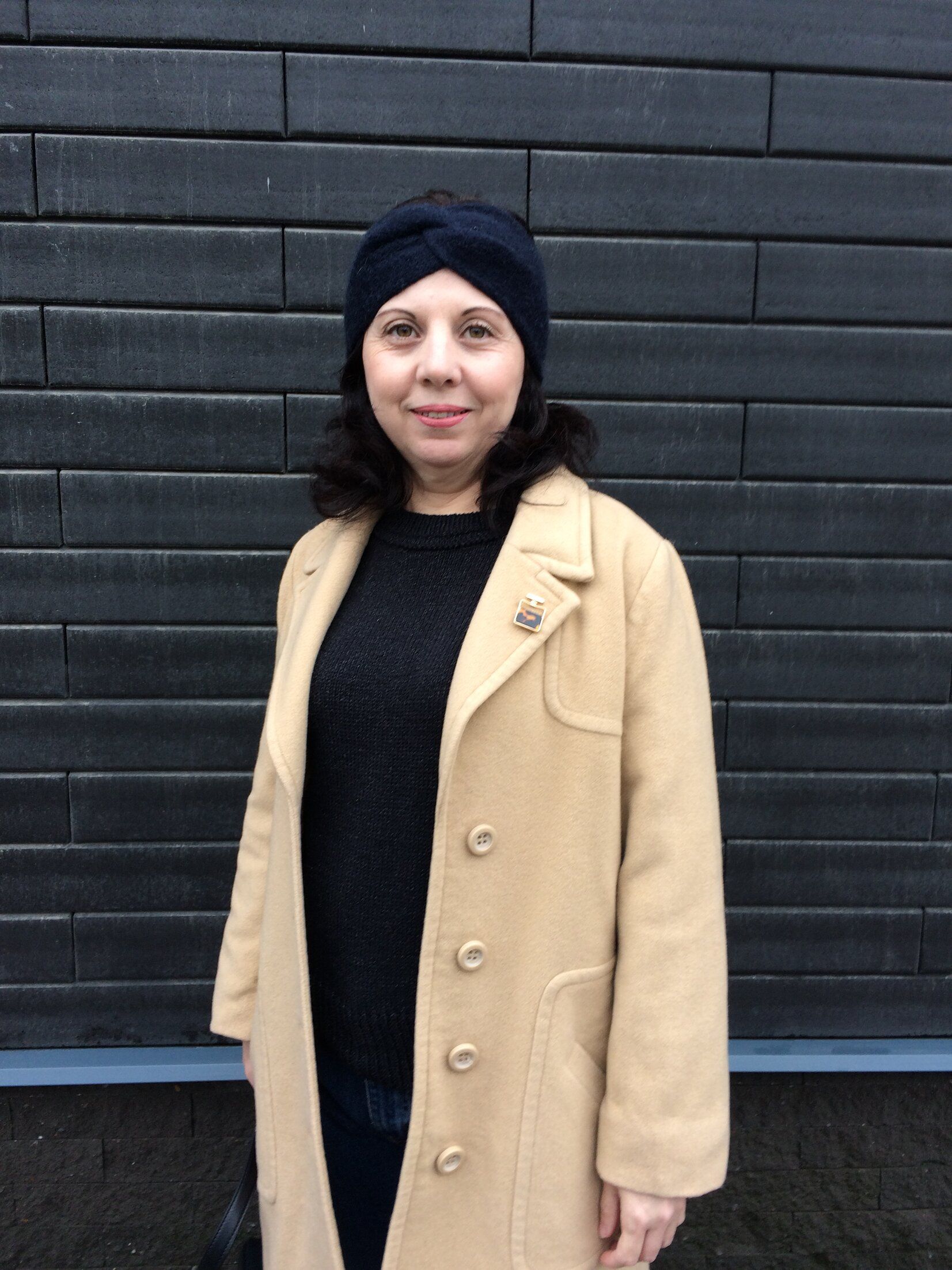 Black knitted turban headband worn on the head