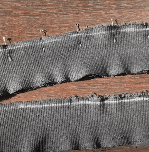 Two cuffs aligned from the wrong side and pinned together