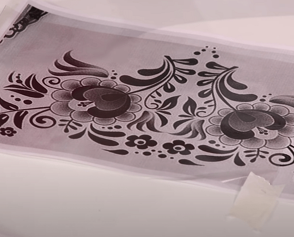 Transfer film taped over a printed rhinestone design