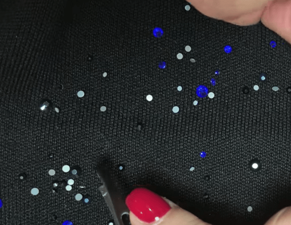 Rhinestones arranged directly on fabric with the flat side down