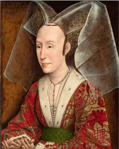 Tall, layered medieval headdress with decorative folds
