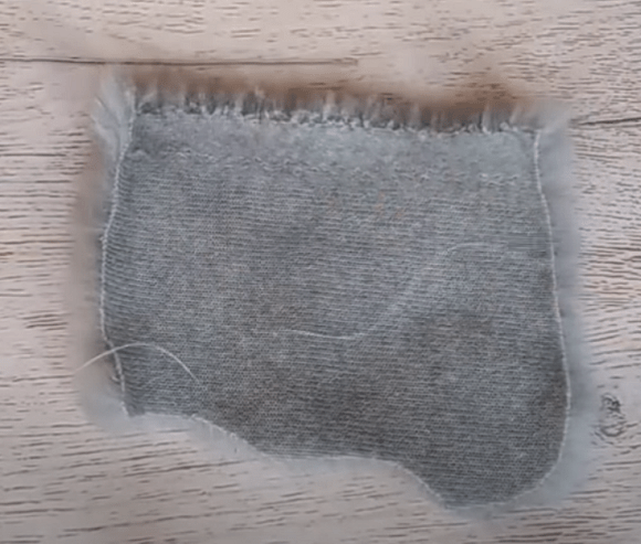 Sewn gray knit piece for the hat
