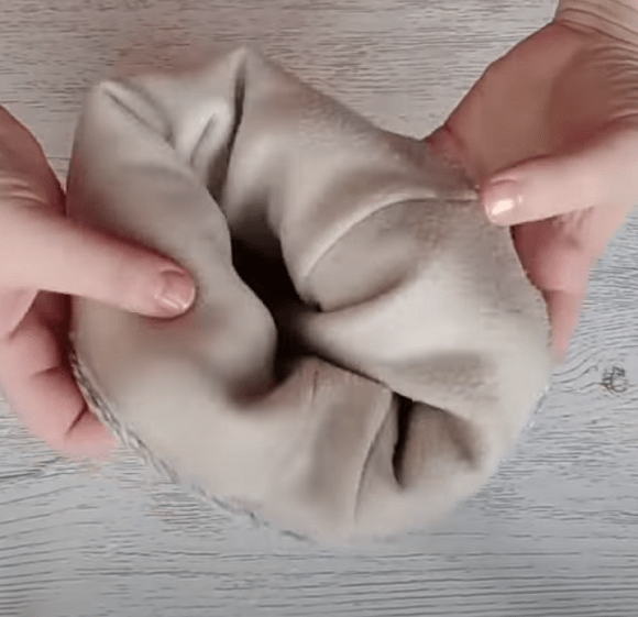 Turning the sewn double hat from a sweater right side out