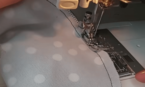Sewing a footie piece on a sewing machine