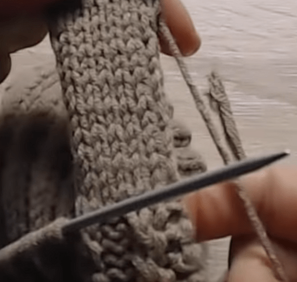 Shaping the side and thumb area of a mitten on two needles