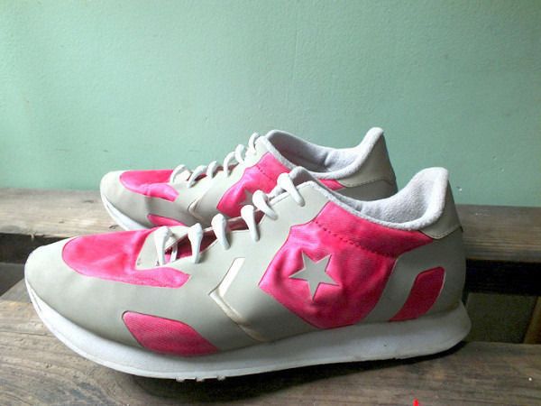 White and grey trainers with bright pink fabric panels