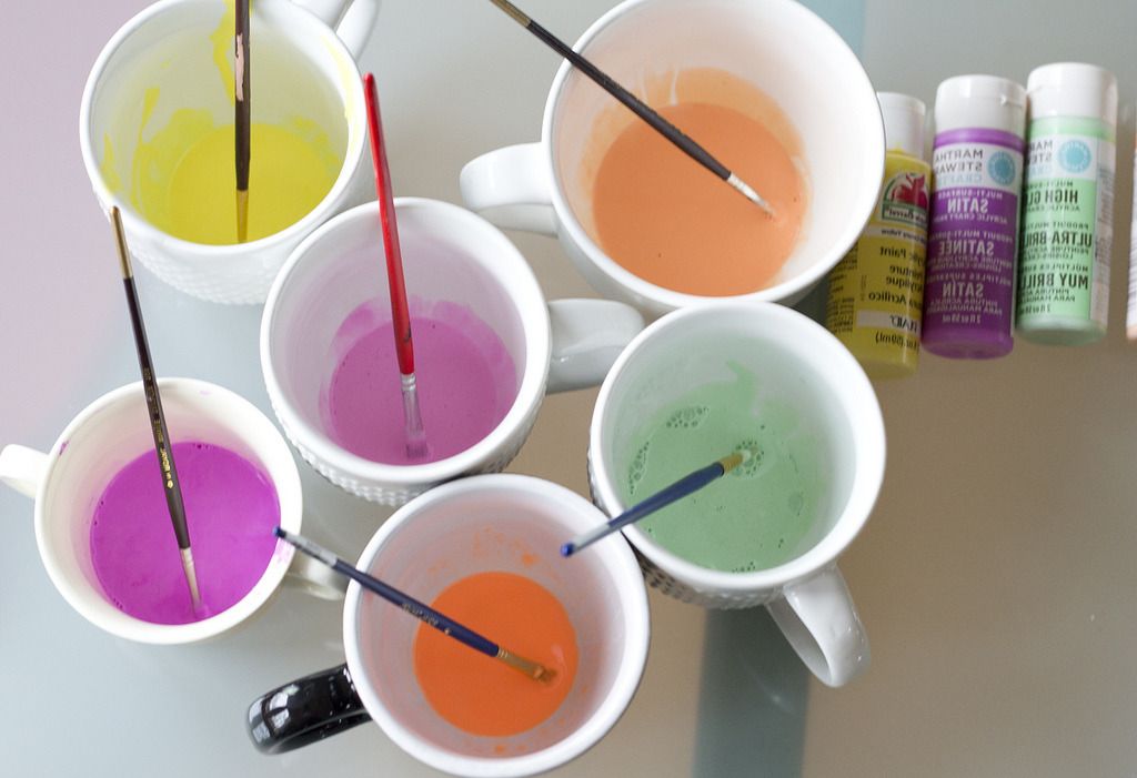 Cups of coloured fabric dye with brushes