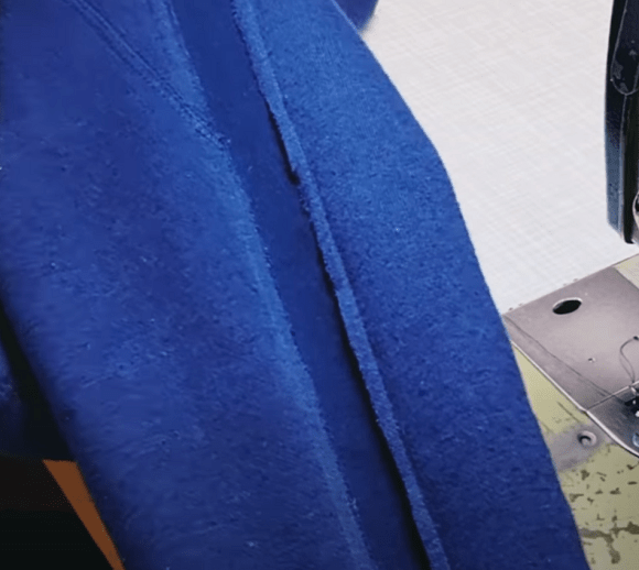 Side panel sewn onto children's knit pants with an overlapping seam
