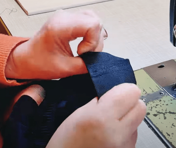 Elastic threaded through the new waistband and stitched closed