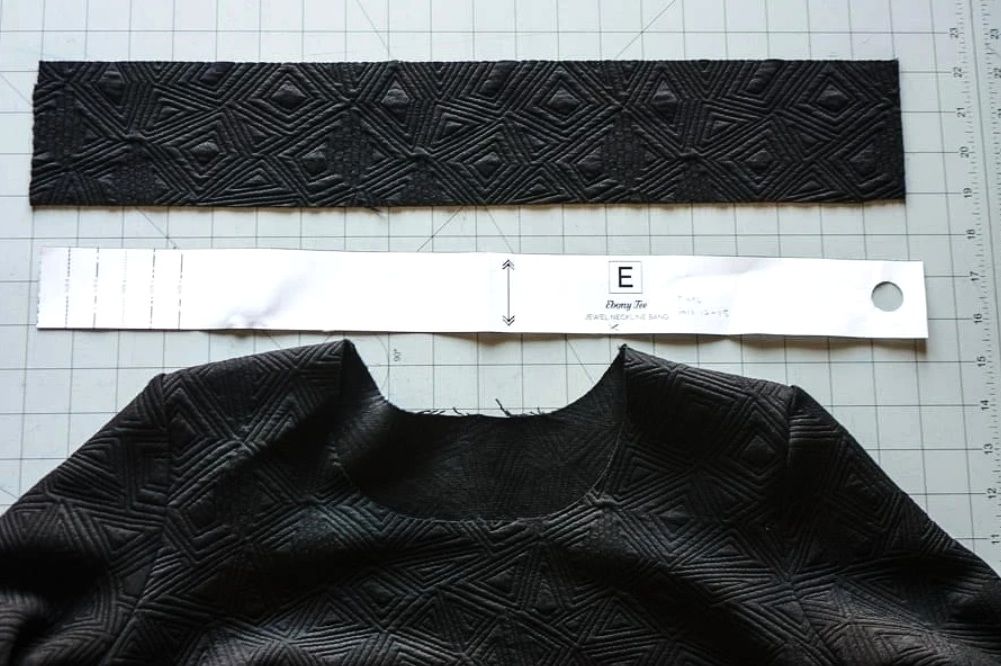 Knit fabric strip for neckline finishing shown with a ruler