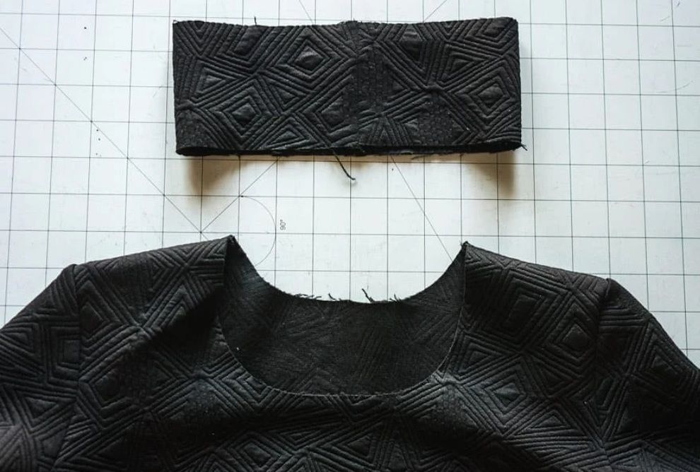 Strip folded in half for a dimensional neckband