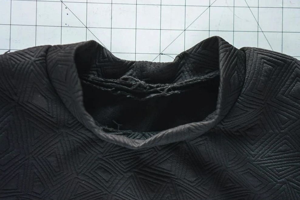First seam attaching the dimensional neckband, seen from the inside