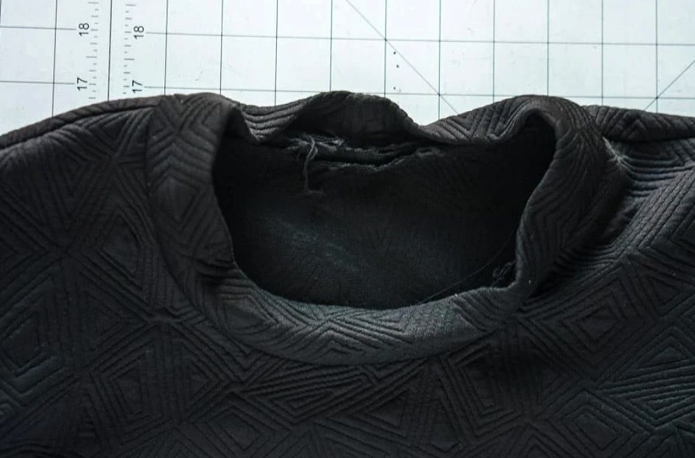 Neckline after forming the dimensional roll