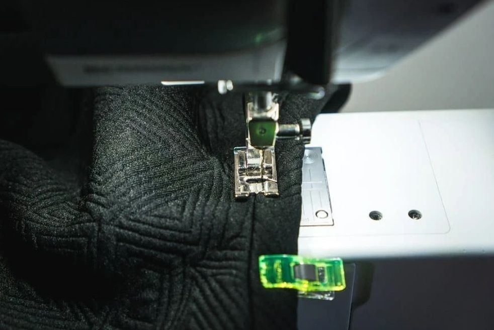 Stitching the dimensional neckband on a sewing machine