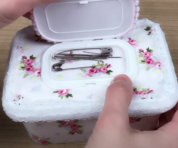 Storage container for pins and needles