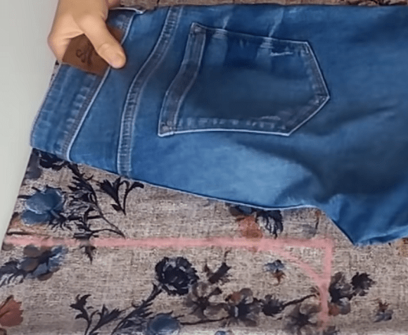 Marking the fabric for the skirt-pants against jeans