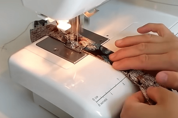 Stitching the waistband of the skirt-pants