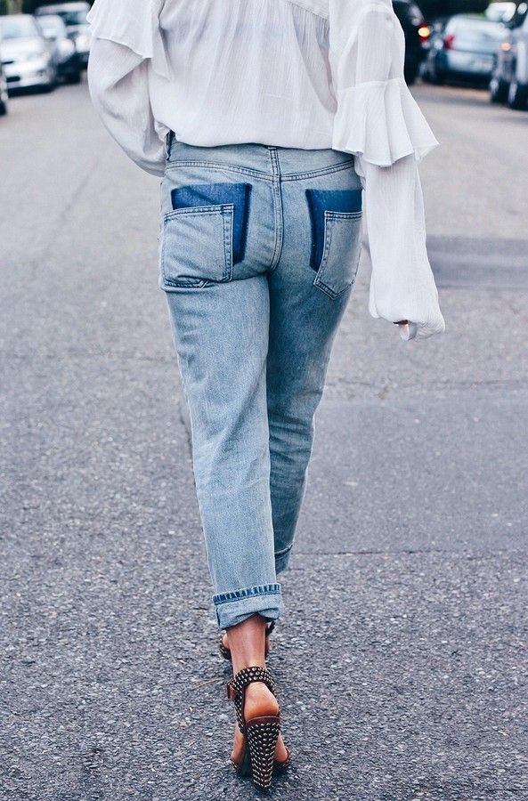 Finished jeans with offset pockets