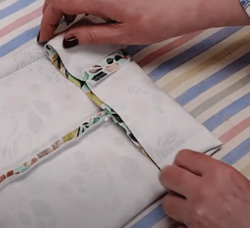Folding hem allowances on a pant leg from the wrong side