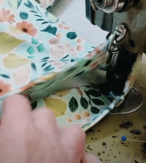 Stitching along the hem of a pant leg next to the vent