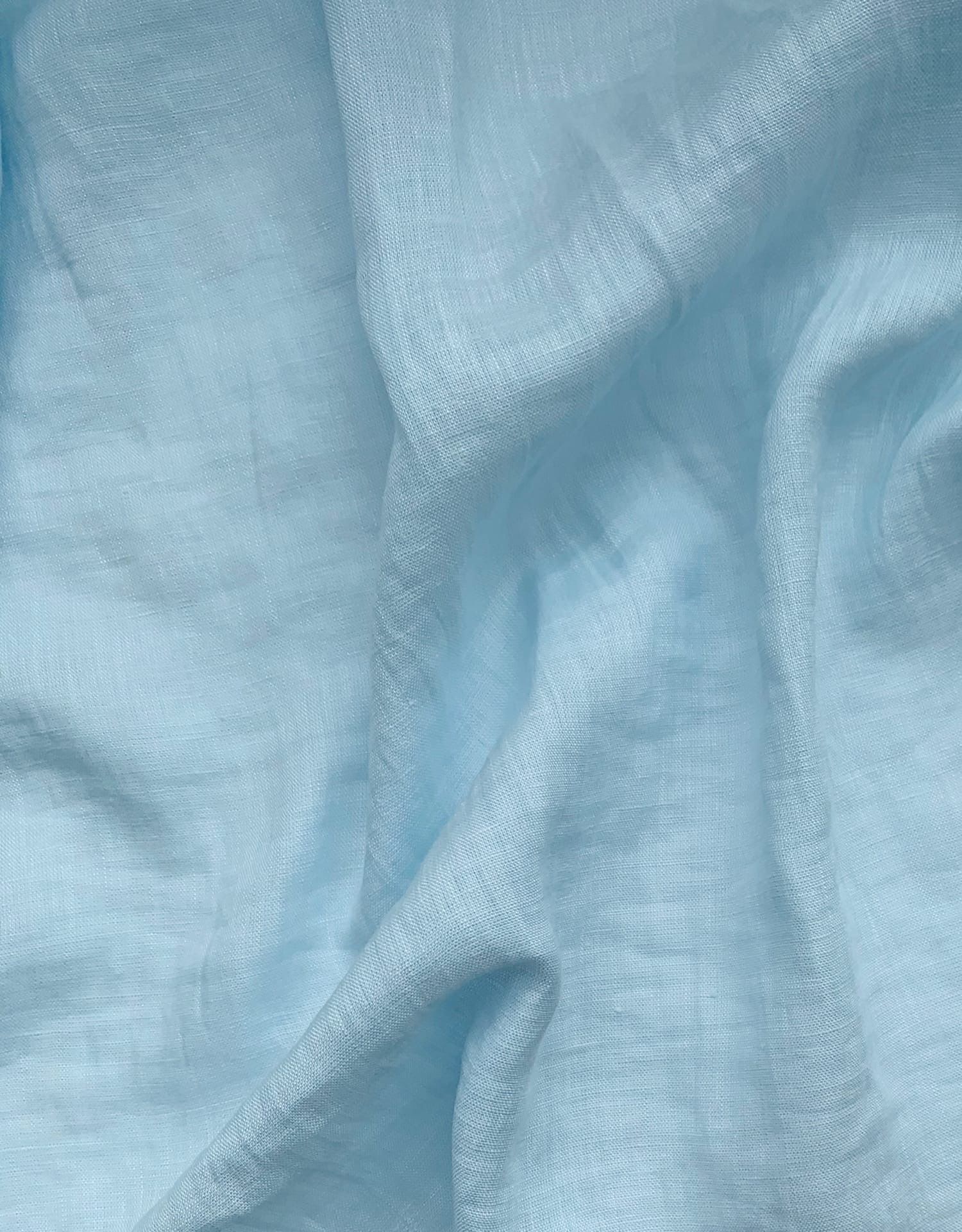 Light blue semi-sheer shirting linen draped in soft folds