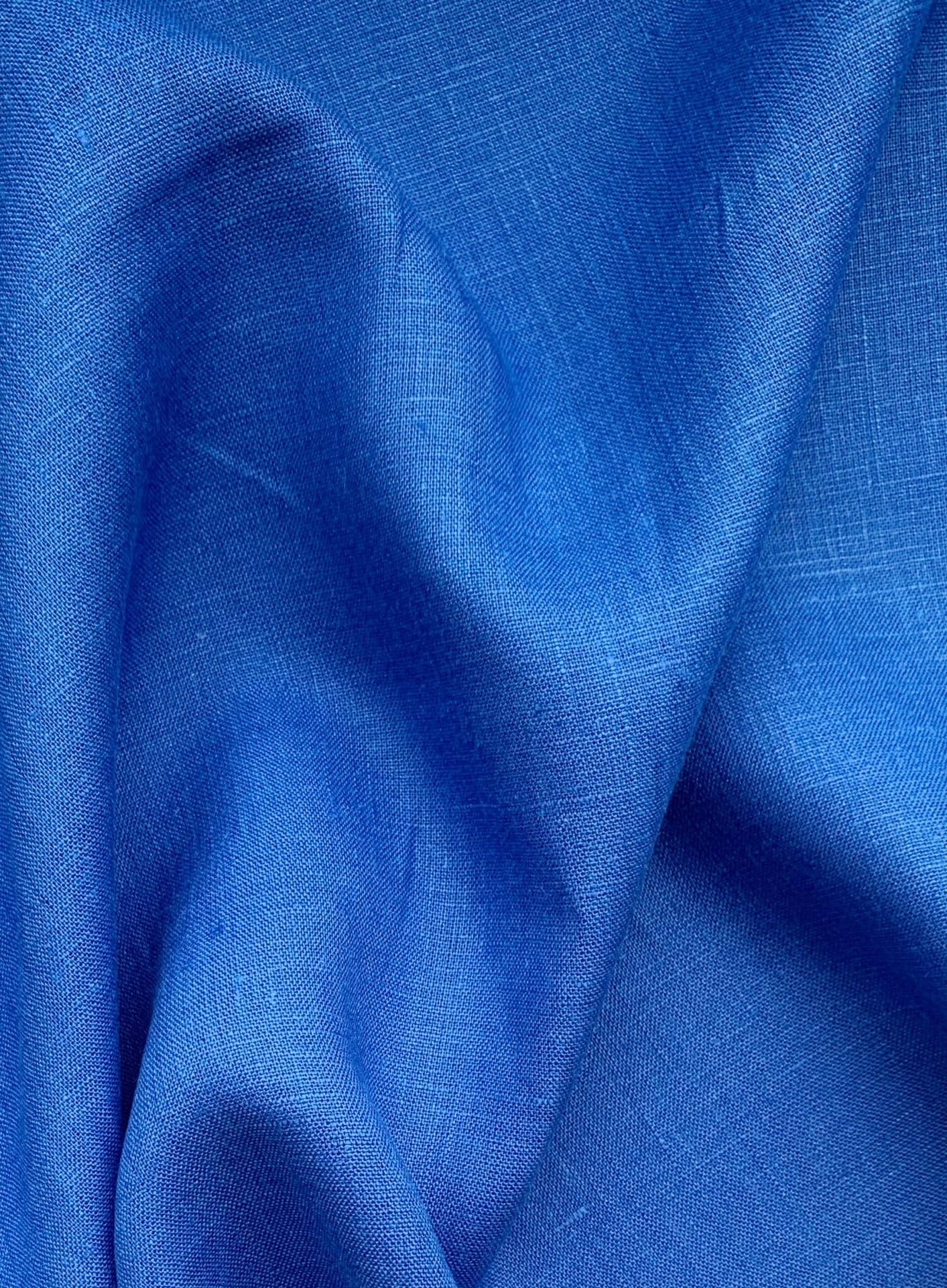 Deep blue suiting linen draped to show its denser weave