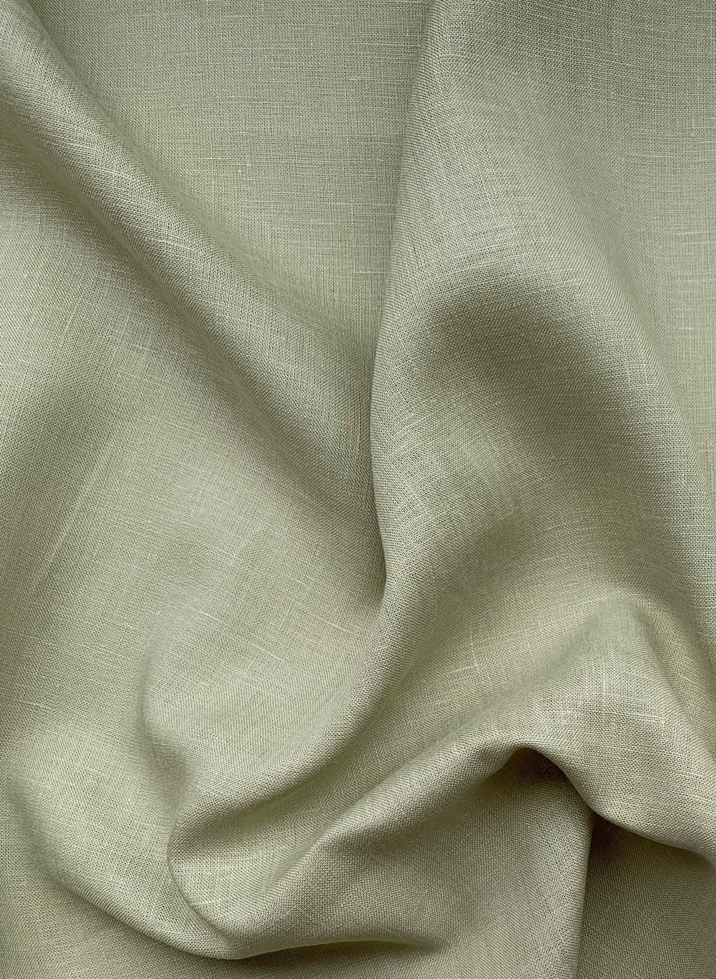 Pale gray-beige softened linen draped in broad folds