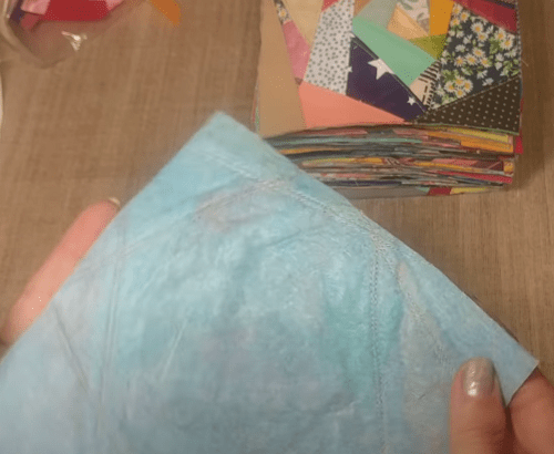 Close-up of seams on patchwork sewn on viscose backing