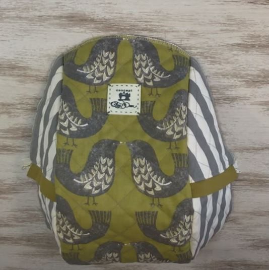 Assembled backpack front with side sections