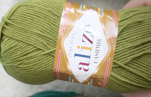 A green skein of Alize Cashmira for a wool hat