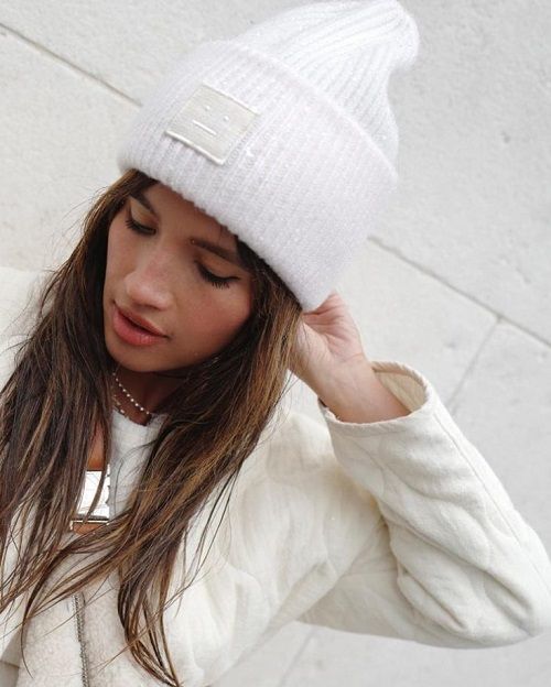 A white bulky hat with a large cuff