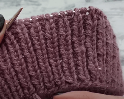The bottom 1x1 ribbing on circular needles for a hat