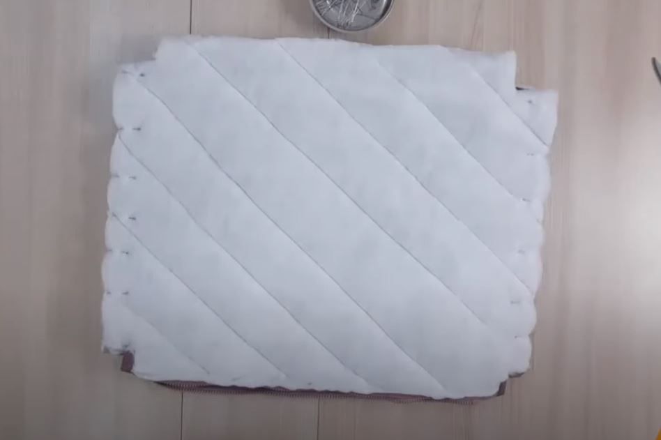 Tote body with sewn side seams, viewed from the insulation side