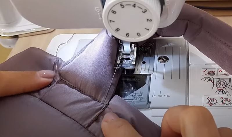 Sewing a handle onto the winter tote on a sewing machine