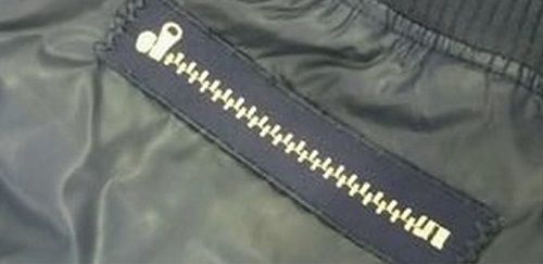 Zipper sewn over a tear on a jacket