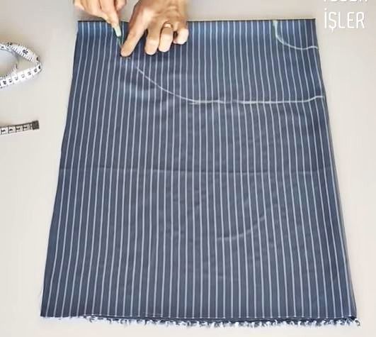 Marking the neckline and upper dress line on folded fabric
