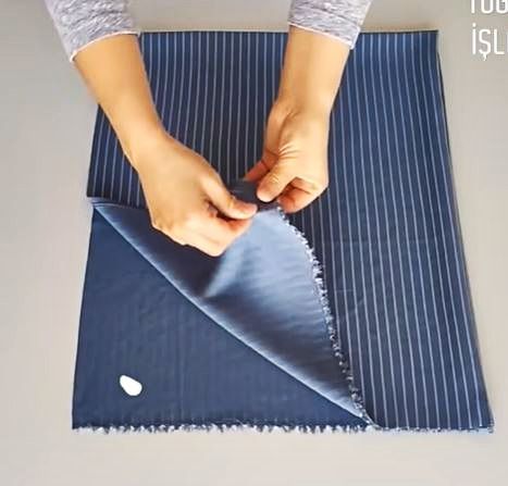Folded fabric for cutting a children’s no-pattern dress