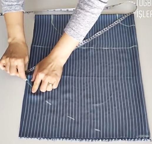 Marking the dress side and hemline with a measuring tape