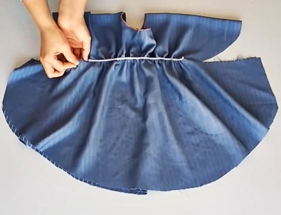 Elastic positioned along the bodice line on the dress piece